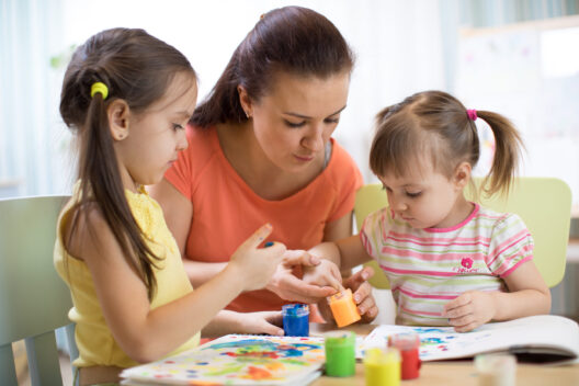 Teacher and pupils in the art workshop